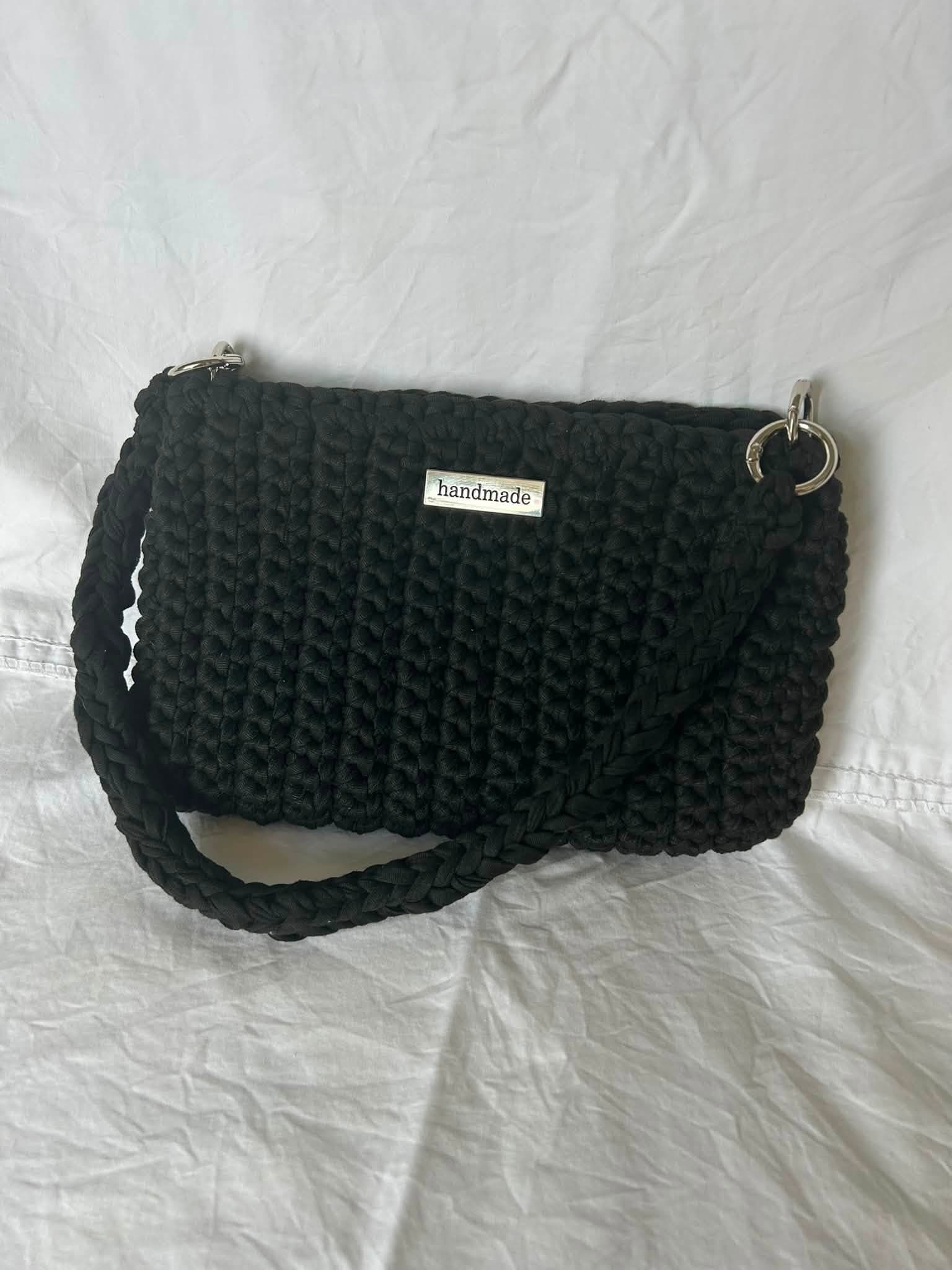 Ali’s handmade black crochet small bag with its strap
